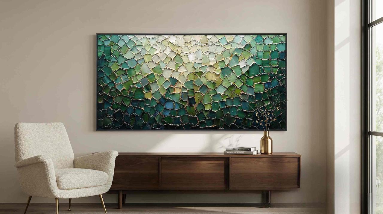 A captivating horizontal abstract wall art piece with rich green and teal palette knife textures enhances a modern minimalist living room over a wooden cabinet.