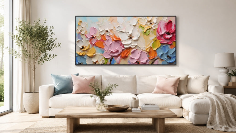 Colorful textured floral wall art above a cream sectional sofa in a bright modern living room