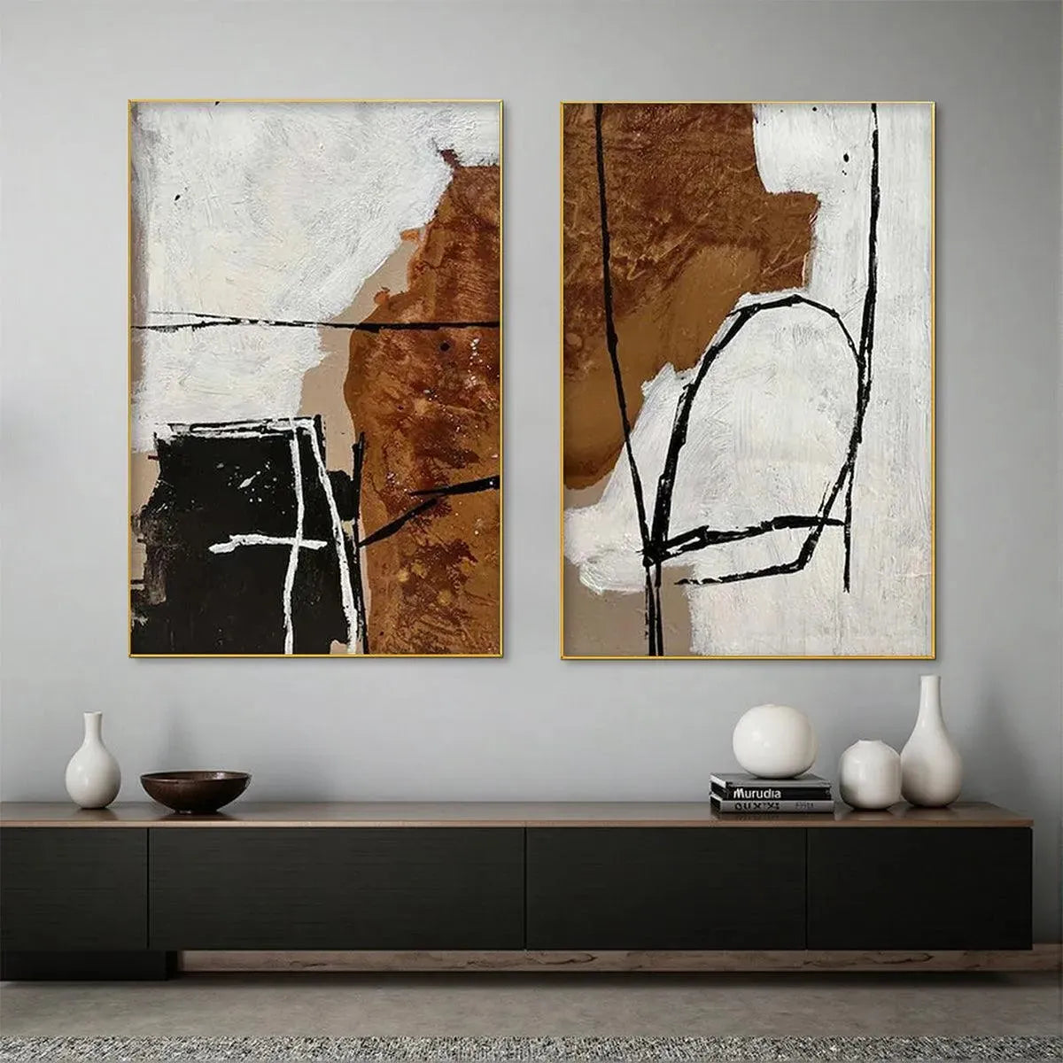Set of 2 brown and white abstract vertical paintings with gold frames, featuring textured art and bold black lines.