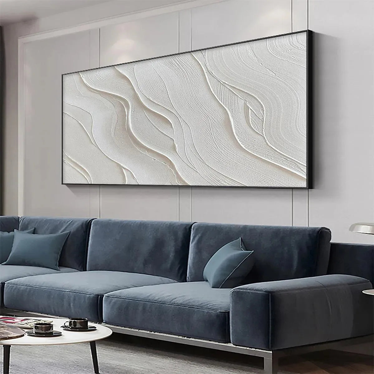 Serene Ripples large horizontal textured white abstract art, creating a tranquil focal point in a modern living room setting.