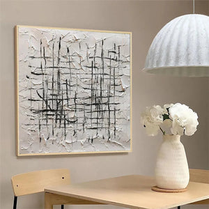 WOVEN LINES abstract painting by Javier Ramirez. Textured white canvas with black lines, gold frame, modern minimalist art.