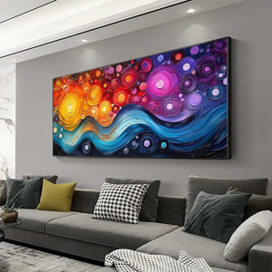 COSMIC WHIRL abstract swirl painting by Willow Davies: horizontal impasto, warm colors to blue waves, on wall.