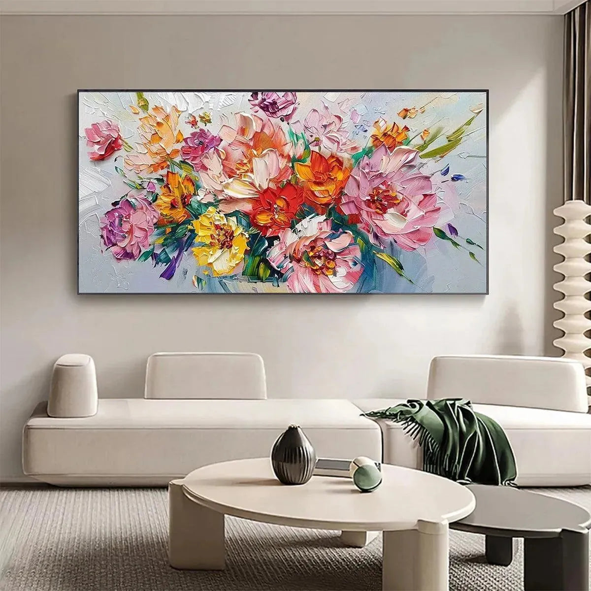 Impasto floral bouquet painting in vibrant colors above a sofa in a modern living room.
