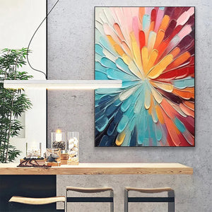 Vibrant, textured abstract painting 'Colorful Radiance' with dynamic radiating strokes, displayed in a modern dining area.