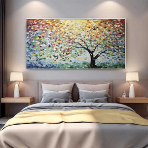 Liam O'Connell's Rainbow Tree impasto painting above bed. Horizontal textured artwork, vibrant multicolored leaves.