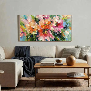 Blushing Blooms textured floral painting, pink & orange, elevating a bright modern living room with beige sofa.