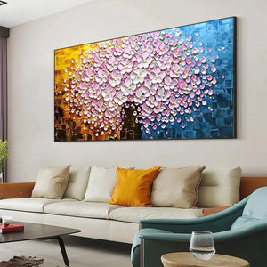 PINK BLOSSOM DREAM textured impasto floral painting with pink blossoms on warm orange & cool blue background above sofa.