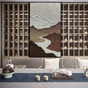 EARTH RIVER: Textured modern wall art with brown mountains, white peaks, winding river in a modern room setting.