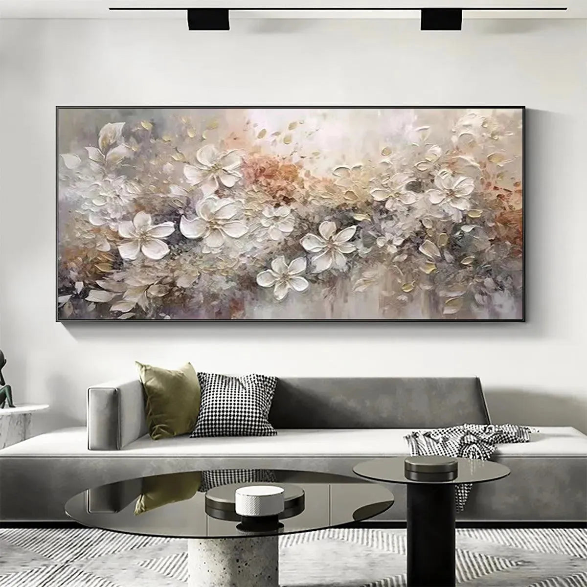 Textured impasto painting of white and beige flowers, Elodie Dubois artwork shown in a living room lifestyle setting.