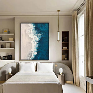 Vertical AZURE COAST abstract painting of crashing blue waves and beige shore in black frame, bedroom art.