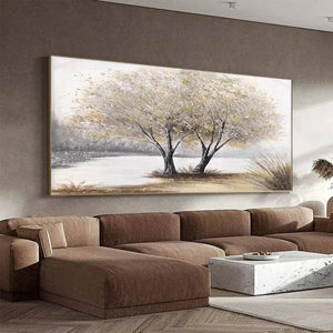 Textured 'Twilight Trees' painting in gold frame above brown sectional sofa in modern living room.