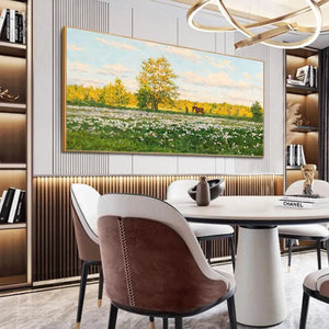 Gold-framed Sunlit Meadow painting: white flowers, golden tree, horse, figure. Ideal for modern dining room decor.