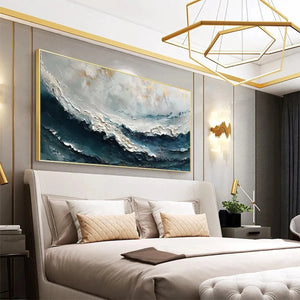 Liam O'Connell's Ocean Dream painting in a bedroom: textured blue, white, gold ocean waves artwork, framed, modern decor.