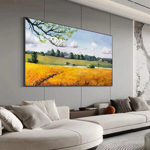 Golden Harvest original landscape painting showing golden wheat field with lake and farmhouse in modern living room.