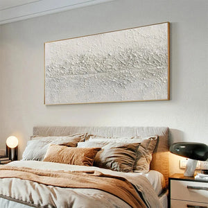 Textured Whispers painting by Javier Ramirez - White minimalist abstract art on canvas in a modern bedroom setting.