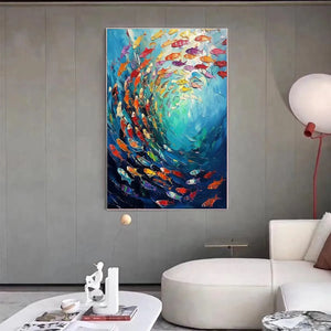 Vibrant 'Whirlpool of Fish' painting, a large-scale colorful school of fish in a contemporary living room.