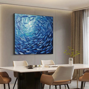 Dynamic Oceanic Whirl fish painting over modern white dining table, enhancing contemporary dining room decor.