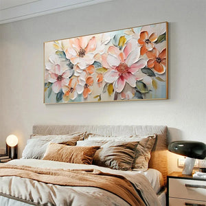 Horizontal impasto painting of peach and white blossoms by Isabella Rossi, displayed above a bed in a lifestyle setting.