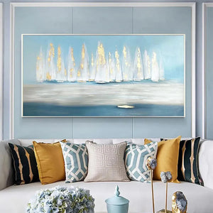 Modern living room with "Golden Sails" abstract seascape art and gold accents above a sofa.