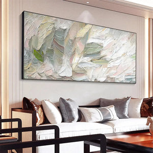 Pink Whispers textured abstract painting by Elodie Dubois, showcasing soft pink, sage green, and white hues above a sofa.