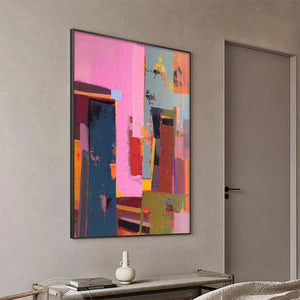 Pink City Abstract wall art by Willow Davies. Modern artwork in pink, teal, red, and brown, framed.