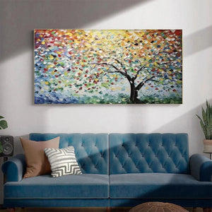 RAINBOW TREE modern impasto wall art by Liam O'Connell, horizontal with textured vibrant leaves, above blue couch.