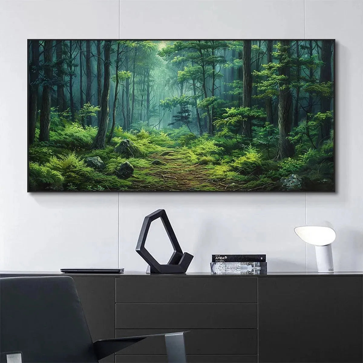 Liam O'Connell's "Forest Path" painting showcasing a sunlit green forest trail with moss and rocks, displayed on a wall.