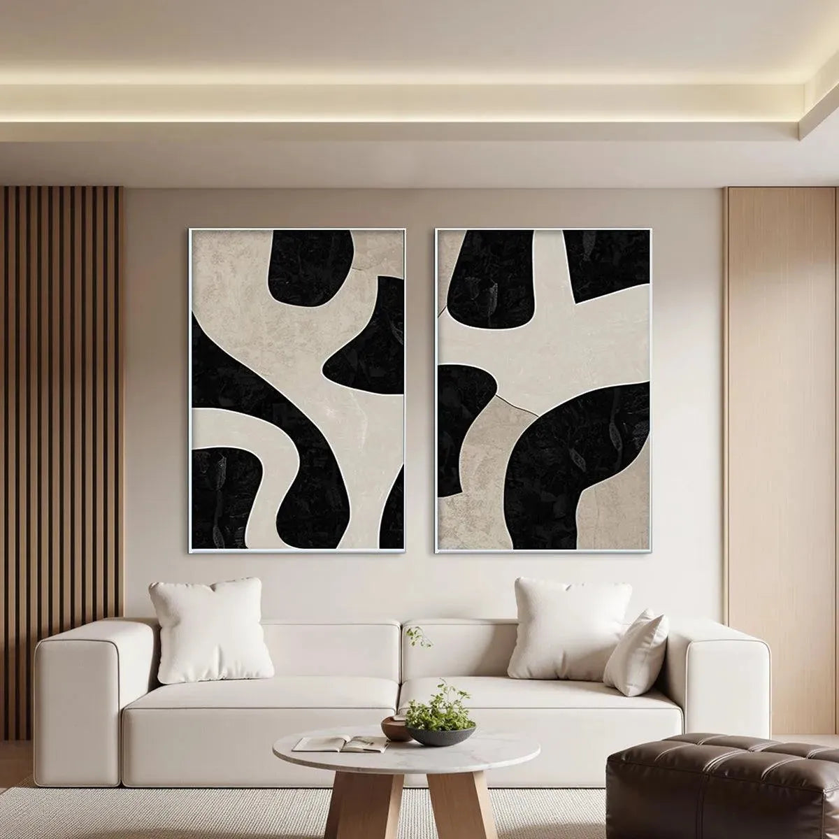 Two vertical abstract paintings, black & beige organic shapes, minimalist style, shown in a modern living room.