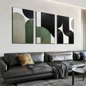 ARCHES TRIPTYCH: Textured minimalist arches in green, black, white & beige above grey sofa.