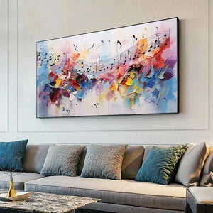 Melody in Color abstract impasto art with musical notes, displayed in a modern living room above a grey sofa.