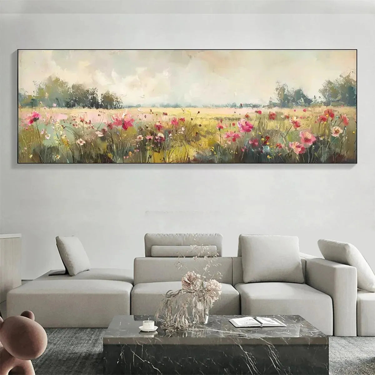 Panoramic impressionist wildflower painting with pink blooms over gray sofa