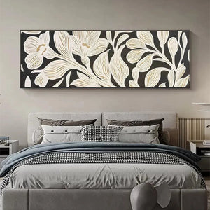 Golden Floral Panoramic wall art above bed, cream floral design with gold accents on black background in bedroom.