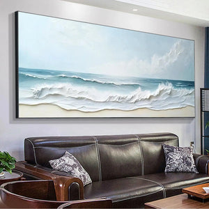 Panoramic impasto ocean waves painting in soft blue tones, mounted above leather sofa.