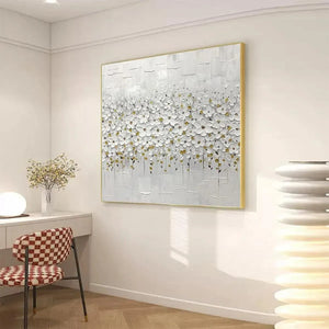 WHITE BLOSSOM FIELD textured impasto floral painting, gold-framed, showcasing scale in a contemporary living room.