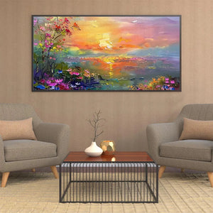 Original watercolor sunset landscape painting with vibrant wildflowers and golden sky reflection on water in modern living room.