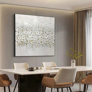 White Blossom Field textured square wall art with gold accents, enhancing a modern neutral dining room.
