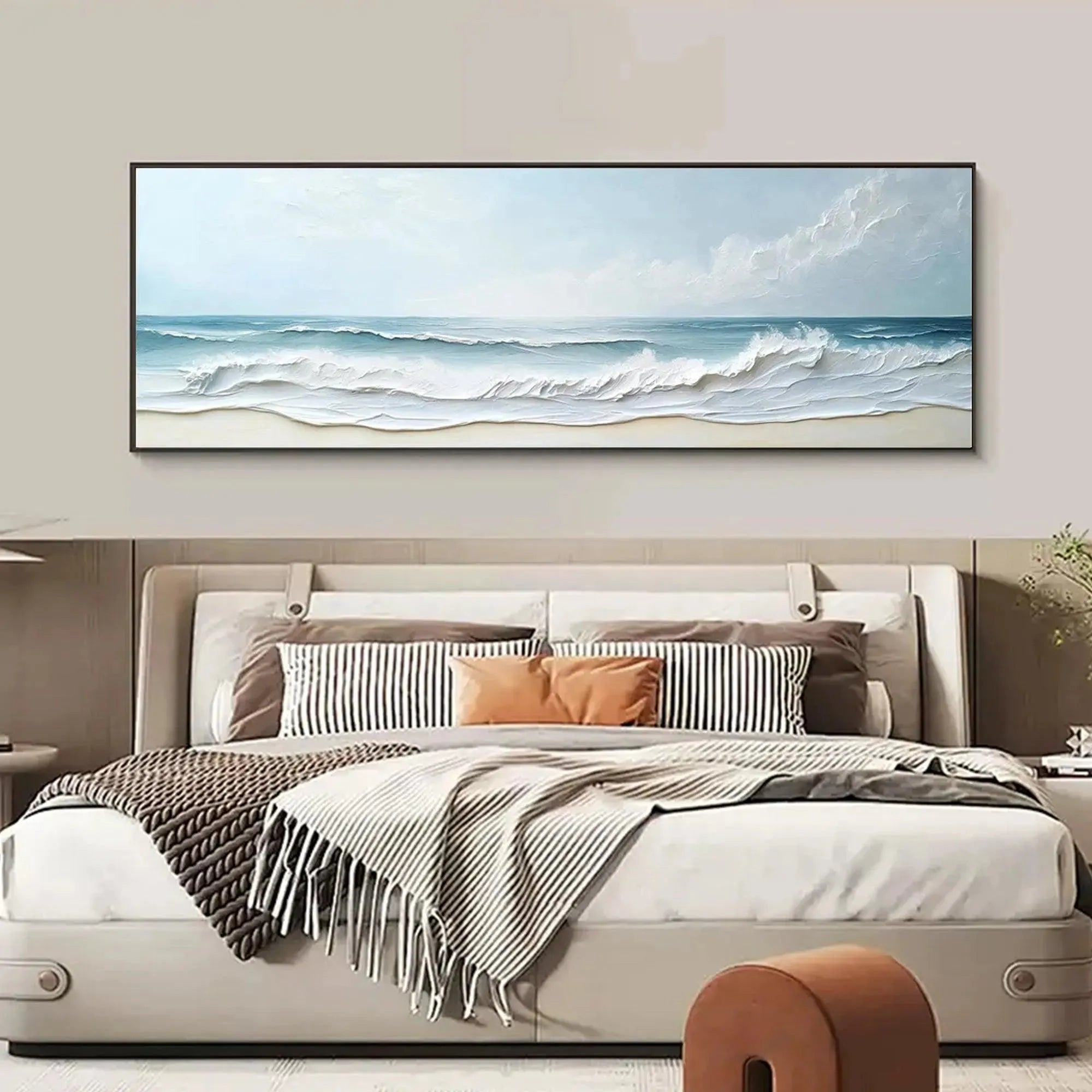 Liam O'Connell "Ocean Waves Panoramic" textured impasto painting displayed above a bed in a bedroom setting.