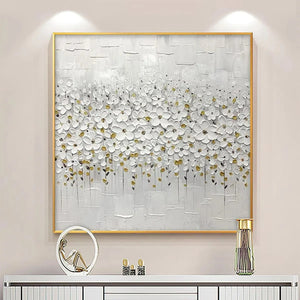 White Blossom Field textured white floral painting with gold accents in gold frame above console table.