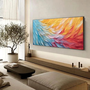 Textured abstract horizontal wall art with wave-like impasto painting in blue, yellow, pink, and red color gradient.