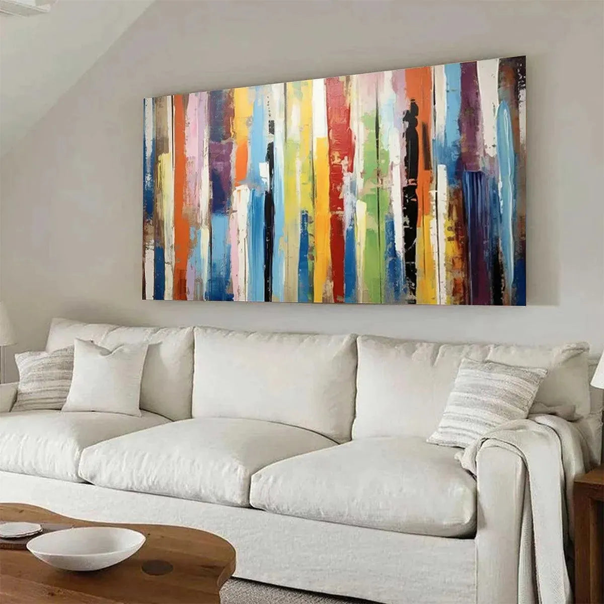Willow Davies COLOR HARMONY abstract painting: colorful impasto vertical stripes above white sofa.