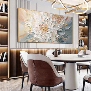 Horizontal Petal Whirl textured floral painting in neutral tones with a gold frame, enhancing a modern dining room.