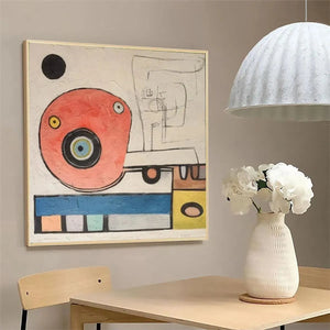Playful Truck abstract art by Willow Davies: red truck form with eye, geometric shapes, square format, gold frame.