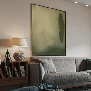 Olive Serenity vertical abstract painting showcasing muted olive green and beige tones in a modern living room setting.