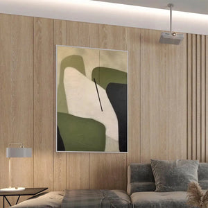Minimalist green abstract painting with organic shapes, olive green, cream, and black, displayed in a modern living room.