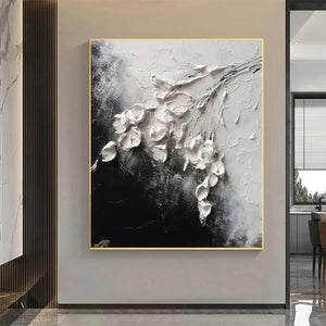 Isabella Rossi textured floral impasto art, white blooms on black, square wall decor with gold frame.
