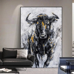 Textured impasto painting of a charging bull in black, white, and gold. Vertical wall art for home decor.