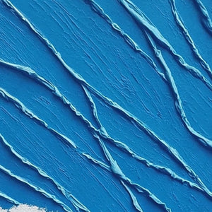 Textured impasto abstract seascape wall art in deep blues and white.