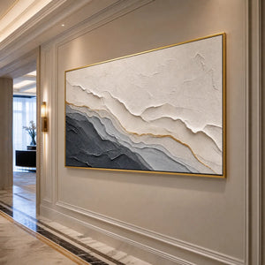 Textured grey and white abstract landscape painting with gold accents in gold frame