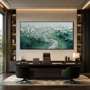 Textured impasto mountain river wall art in green and white above a modern office desk