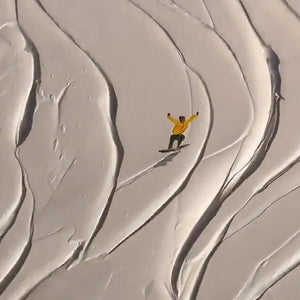 Textured painting of skiers and snowboarders on a snowy slope, winter sports wall art.